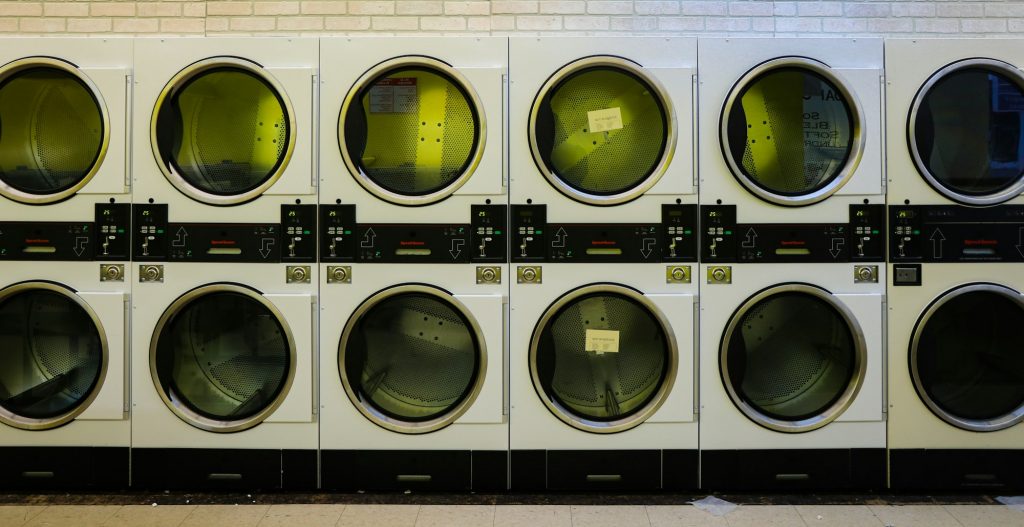 A laundry room with washing machines